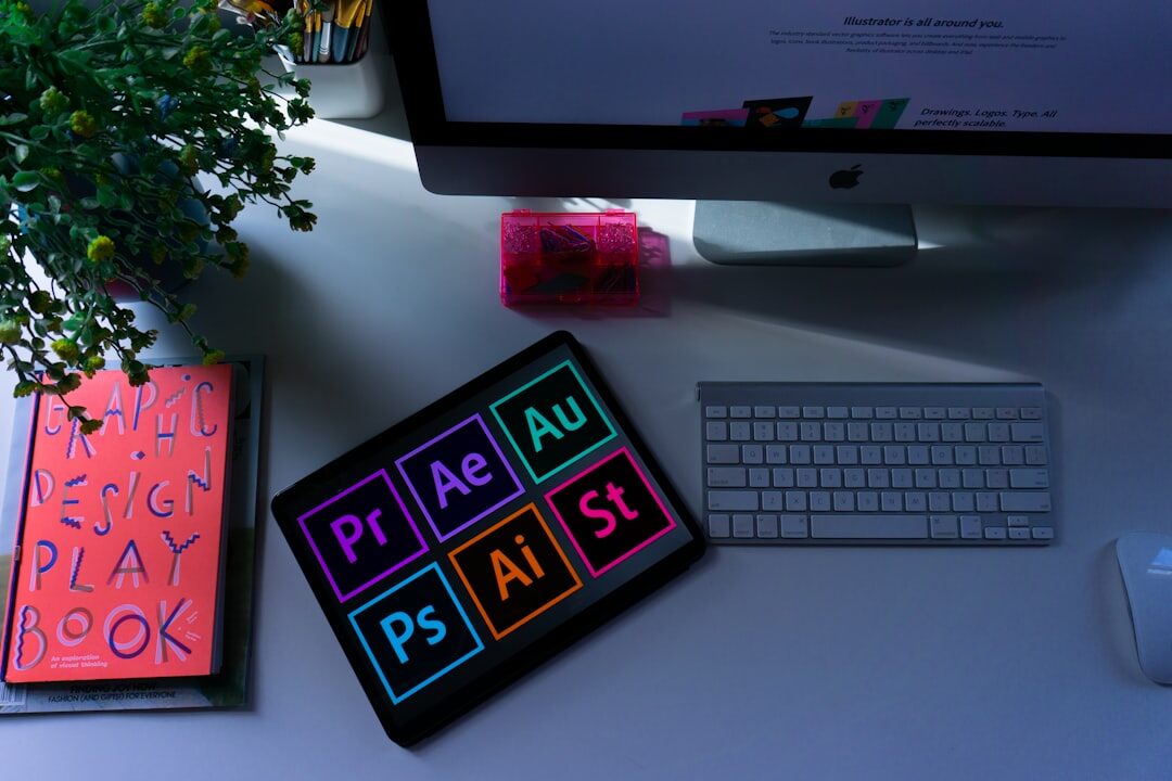 Graphic designer working with paste-up layout tools and colour swatches