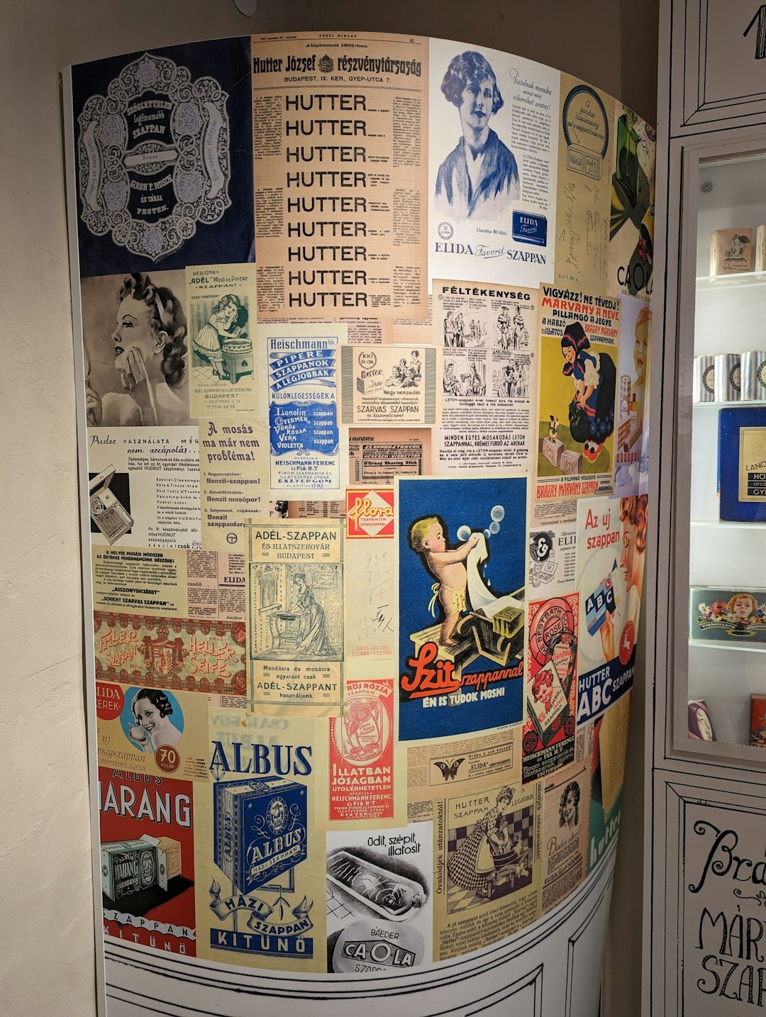 Wall covered with vintage advertising posters from the eighties and nineties