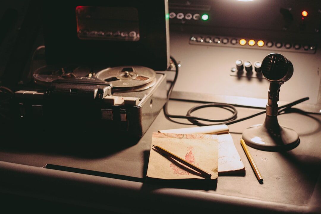 Vintage radio broadcasting studio with microphone and reel tape recorder